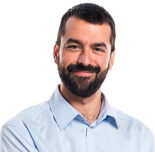 Smiling man in a blue shirt,
            short haircut, brunette with a thick beard